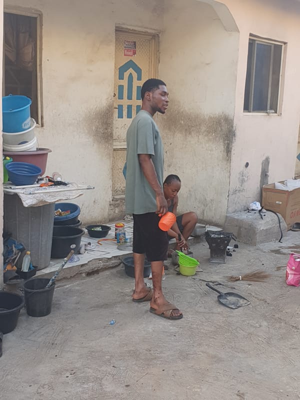 Man and woman work with produce in Lokoja, Nigeria