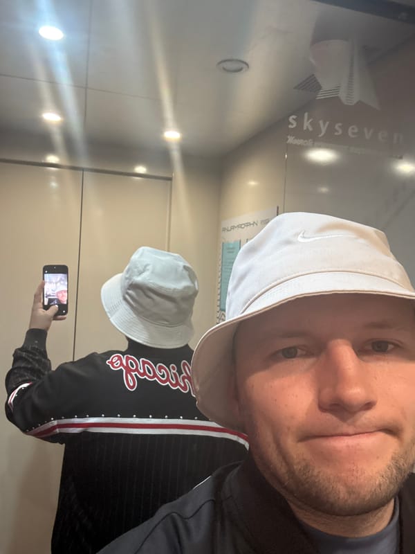 Man takes elevator selfie in Krasnoyarsk wearing Nike hat