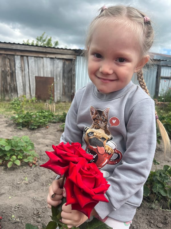 Garden day in rural Russia: flowers, a dog, and summer moments