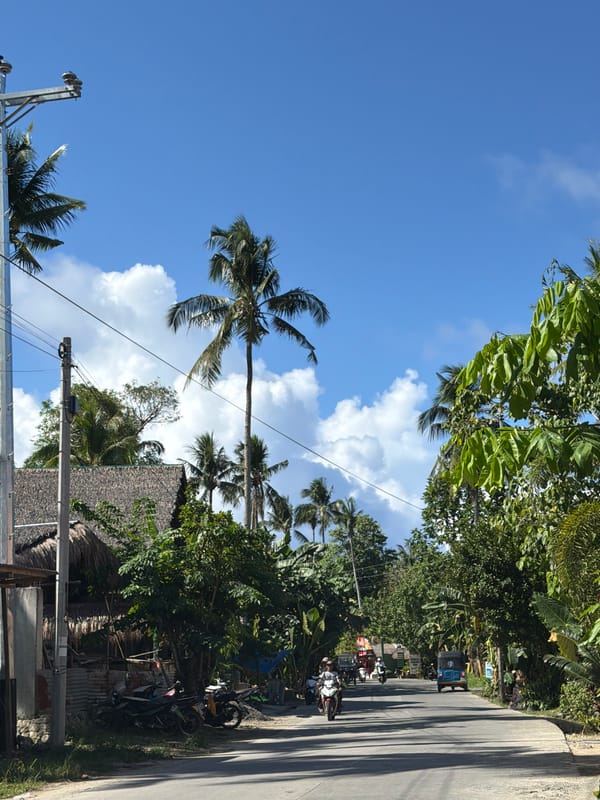 Sunny morning street scene documented in General Luna, Philippines