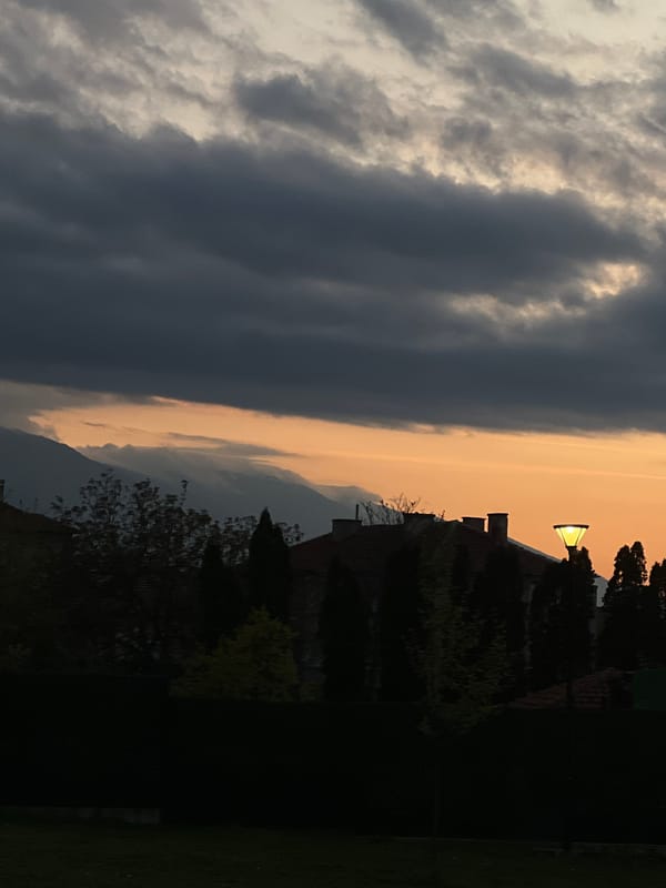 Dusk storm clouds and orange sky observed in Petrich