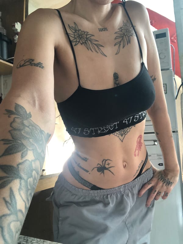 Tattooed woman photographed in Buenos Aires kitchen area