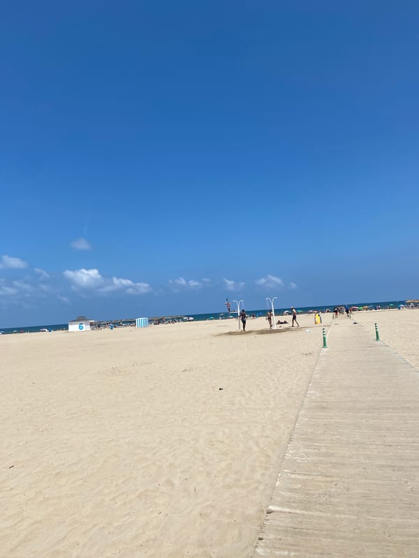 Afternoon at Valencia's beachfront promenade, coffee in hand