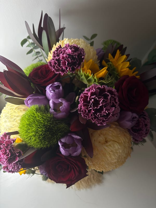 Close-up detail shots of a colorful mixed flower bouquet in Bali