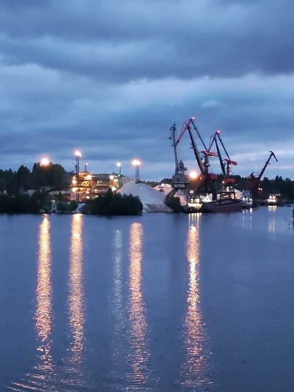 Russian industrial waterfronts observed at dusk with reflected lights