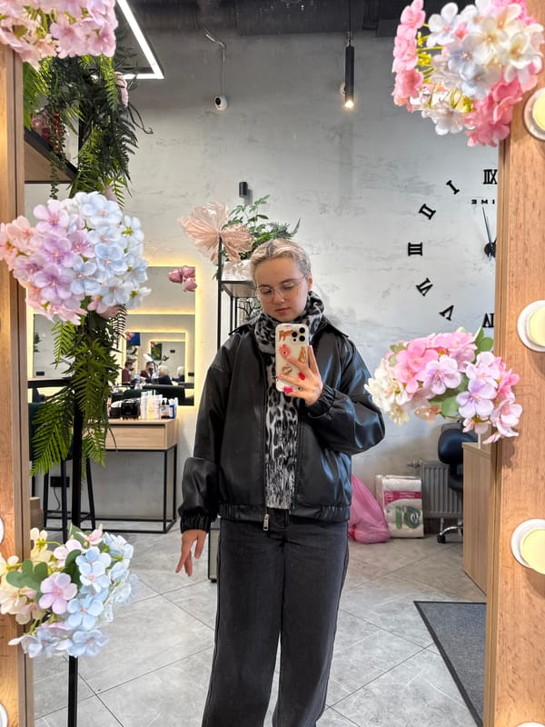 Woman takes selfie at decorated mirror in Saint Petersburg