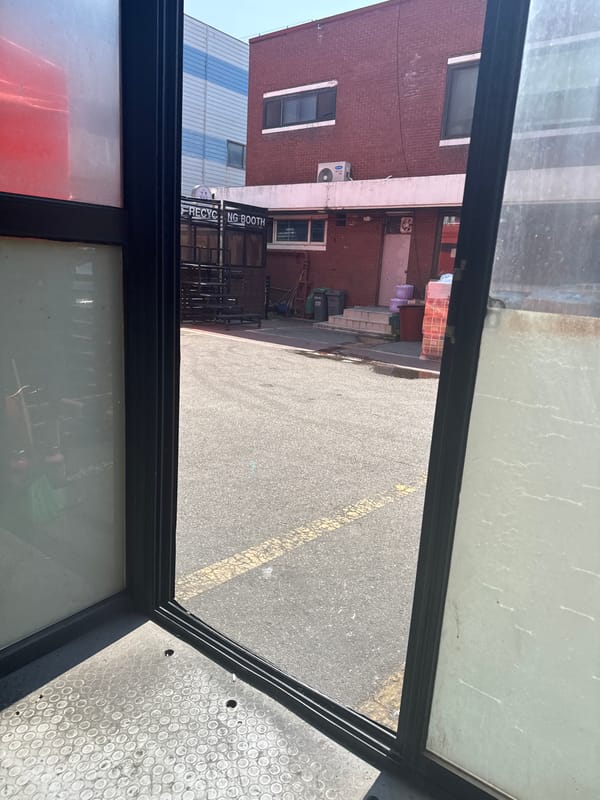 Inside and outside an Ansan industrial warehouse, mid-morning