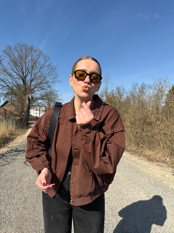 Woman poses for photos on Dreiliņi road