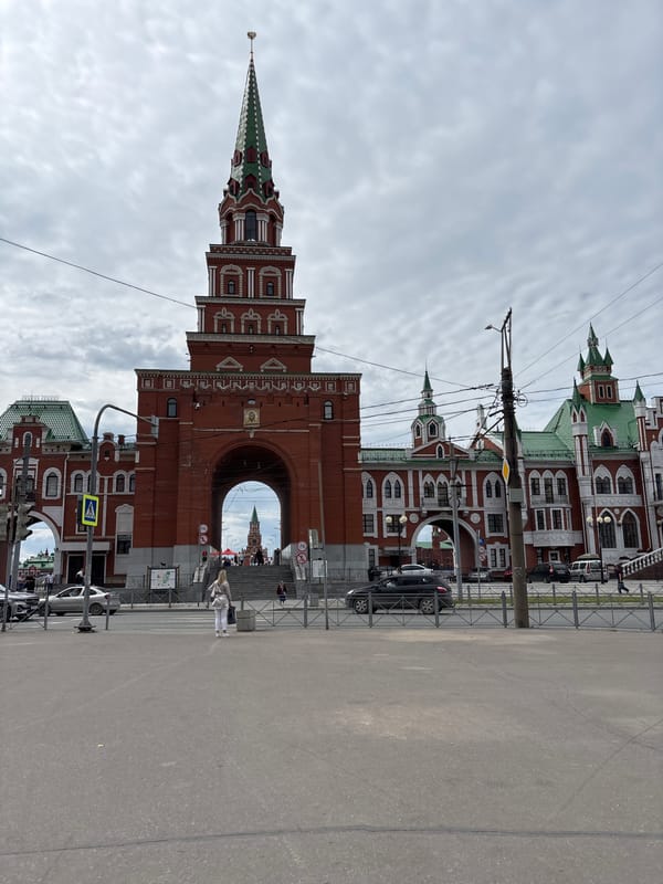 Strolling Yoshkar-Ola's embankment: statues, domes, and riverside streets