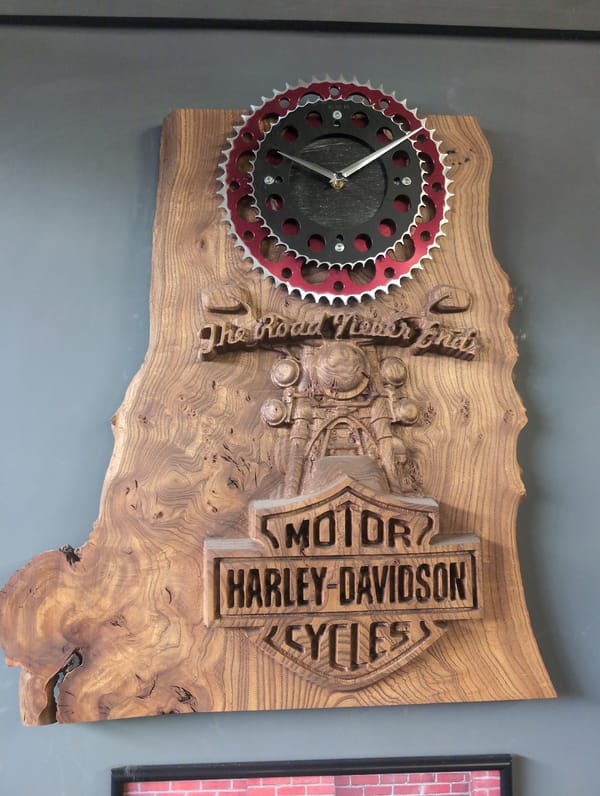 Harley-Davidson gear and a motorcycle in a decorated garage