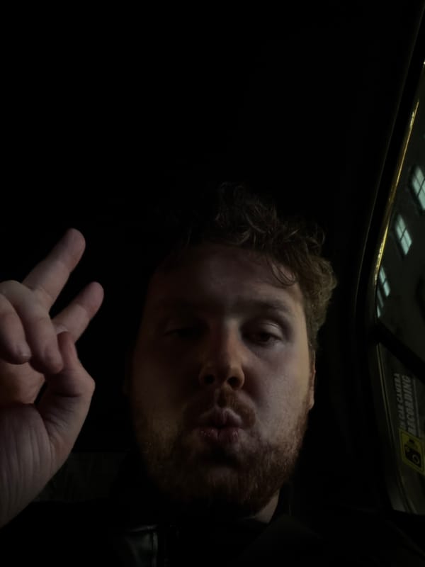 Man makes peace sign in moving NYC vehicle