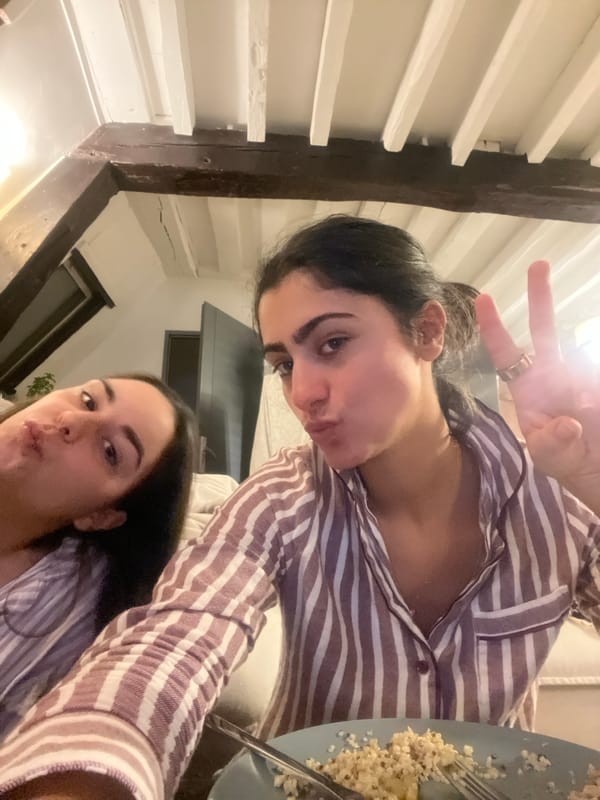 Women captured in casual evening moments at Paris residence