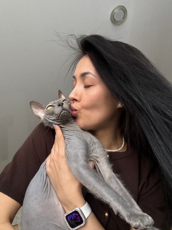 Woman and Sphynx cat captured in intimate home moments