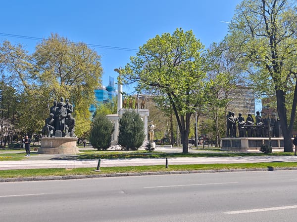 Tourist documents historic monuments in central Skopje park