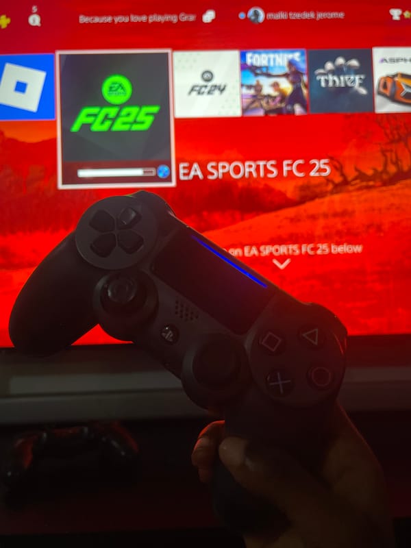 Child plays fighting game on PlayStation in Ado, Nigeria
