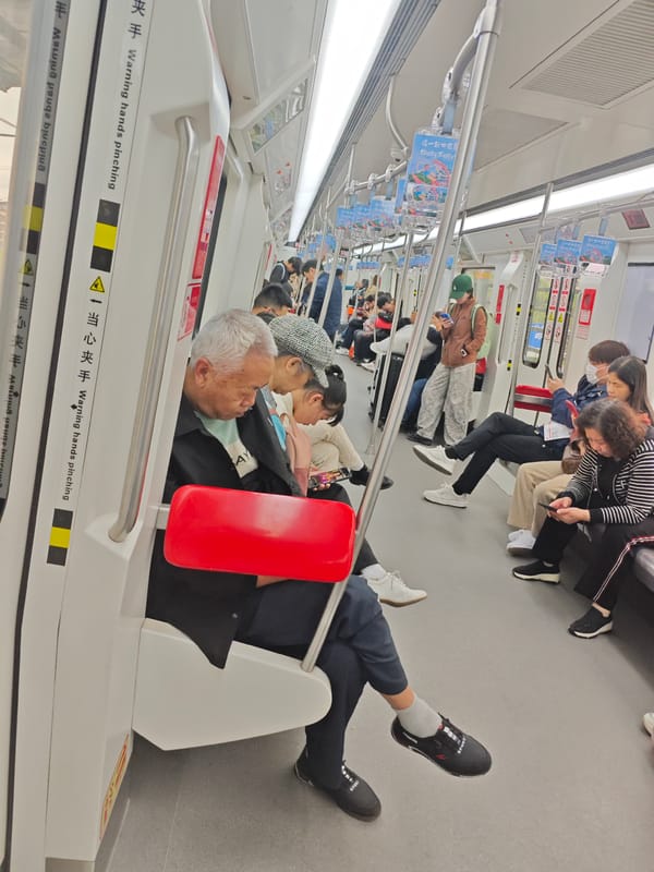 Passengers ride subway in Shapingba District, most using phones