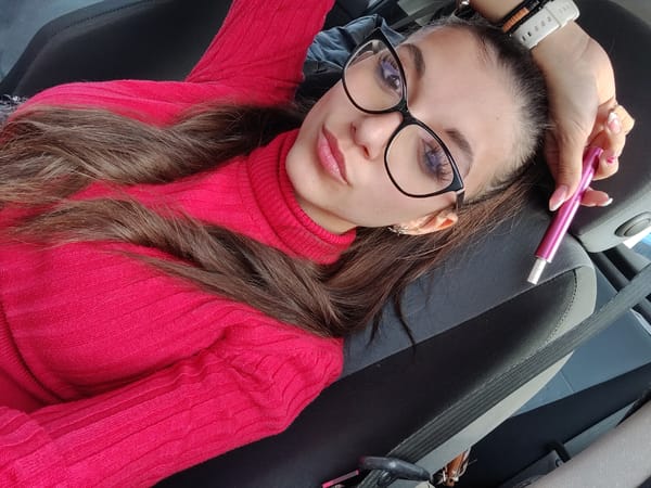 Woman rests in car during afternoon in Plovdiv