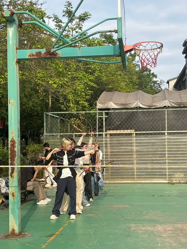 Archery group practices on basketball court in Jiangjin park