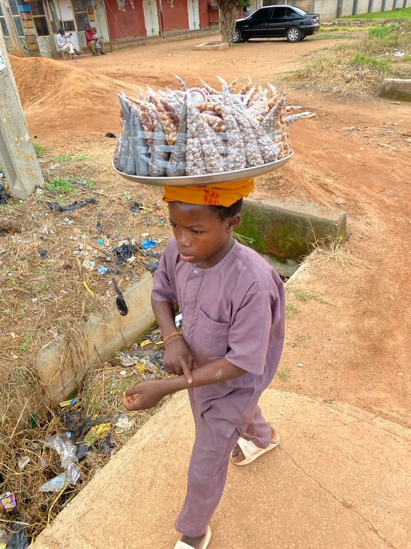 Everyday trade and foot traffic on the streets of Bukuru, Nigeria