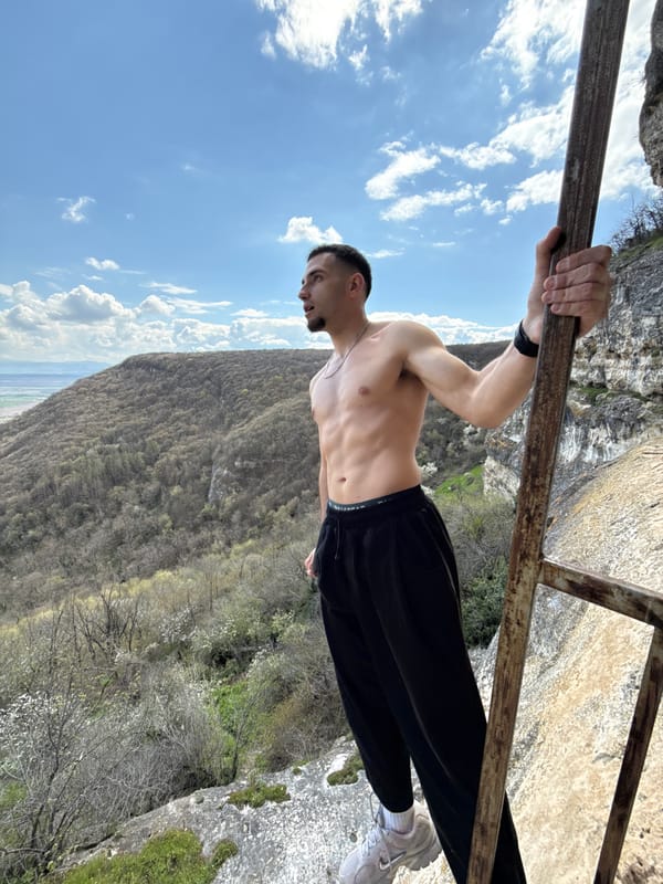 Man performs calisthenics exercise at high altitude in Shumen
