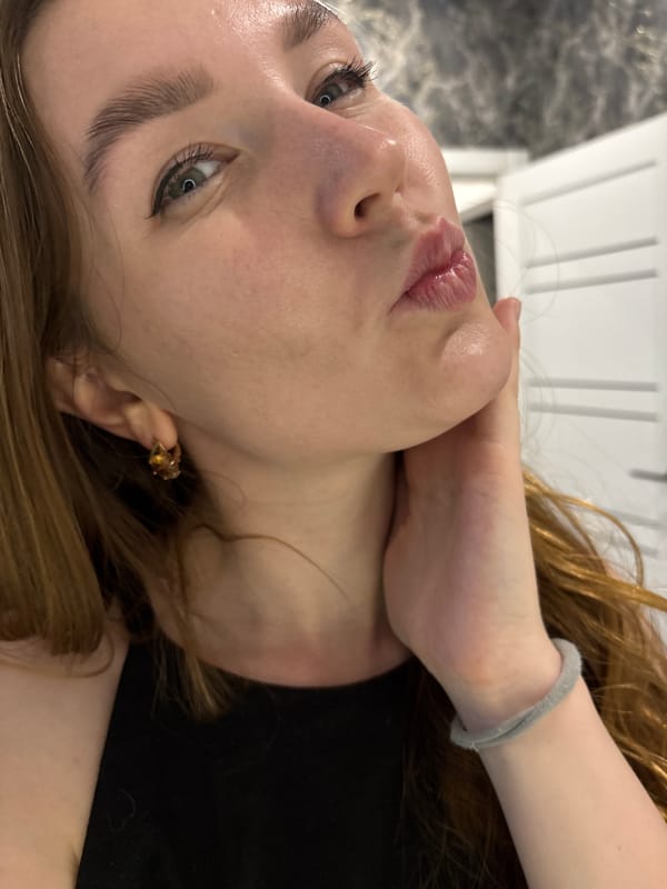 Woman takes selfies with flowers in Izhevsk mirrors