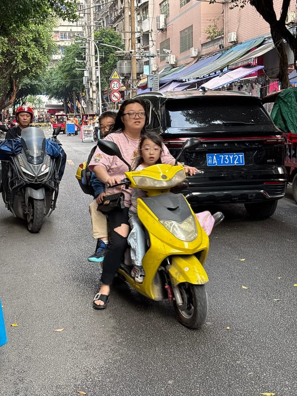 Morning street scene with scooters in Jiangjin, China