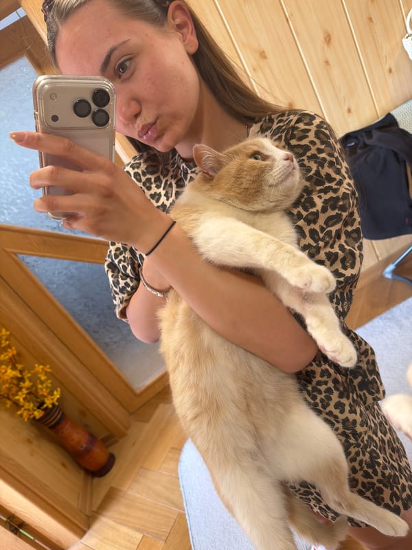 Woman takes selfies with cat in Buhovo home