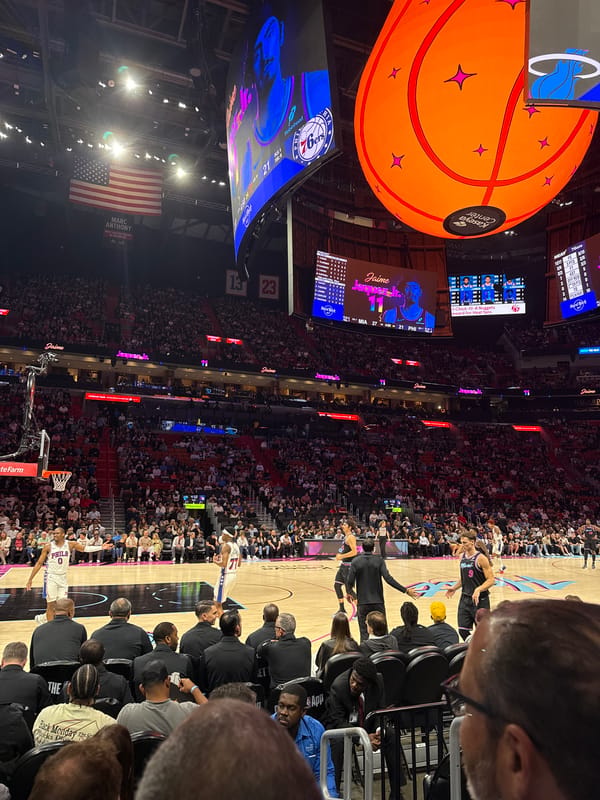 Basketball game at Miami's Kaseya Center with collectibles display