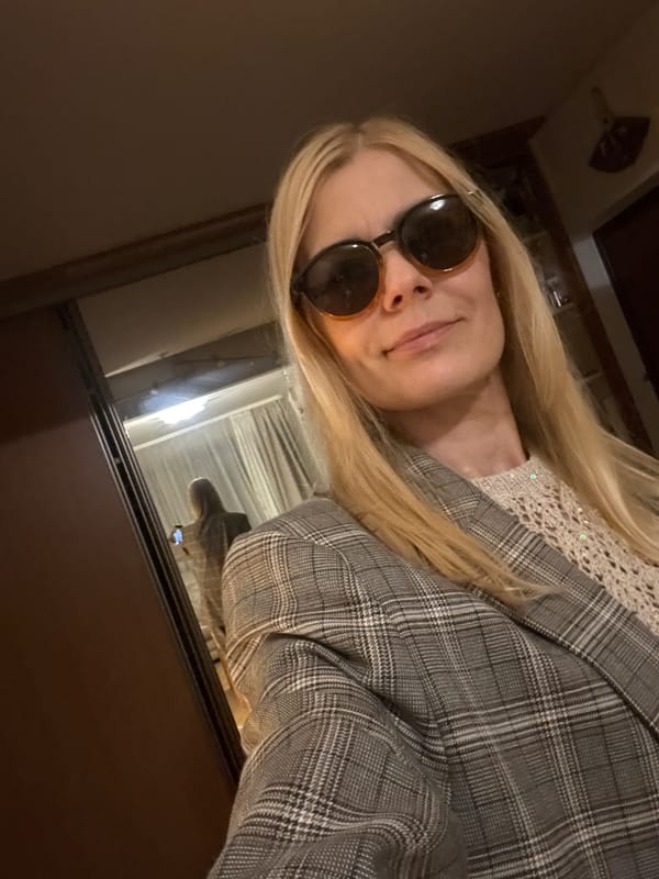 Woman Takes Selfie in Dimly Lit Minsk Location