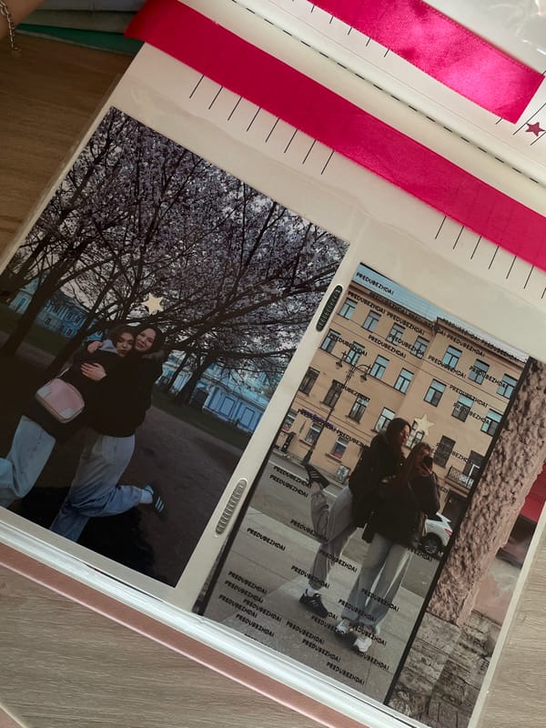 Person documents family photo album in Murino, Russia