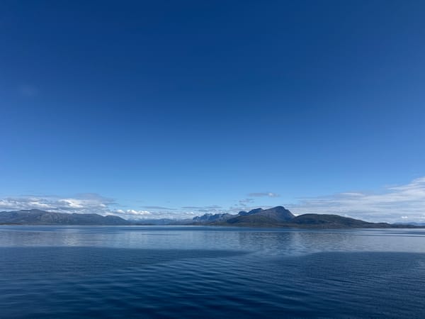 Clear skies over calm Arctic waters off Lødingen, Norway