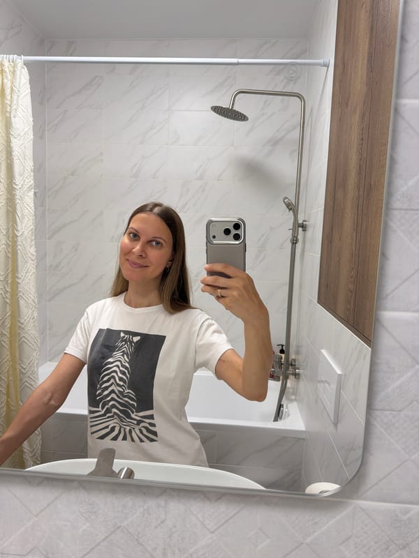 Mirror selfie session across a styled Perm interior
