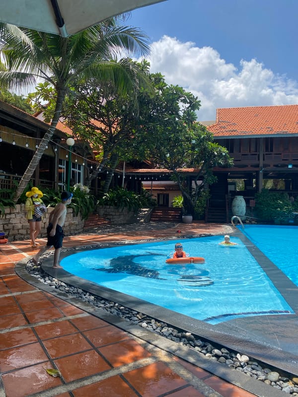 Families enjoy pool and beach time at Vietnam resort