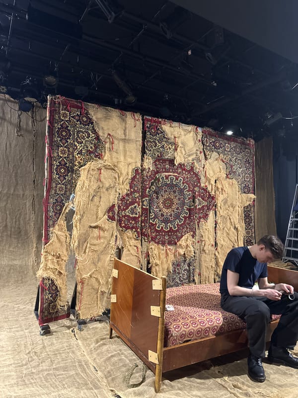 Man examines object while seated on furniture in Moscow