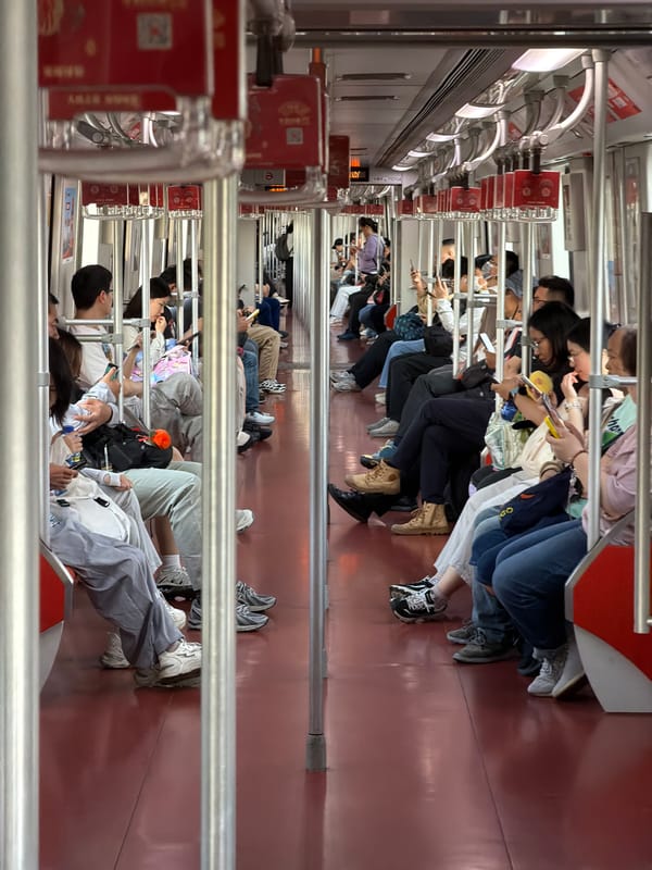 Pudong subway passengers absorbed in phones during morning commute