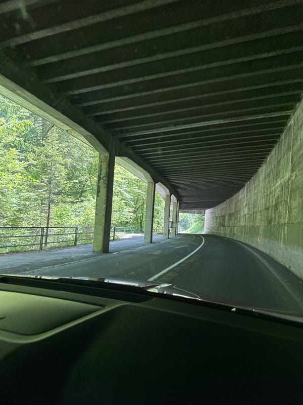 Vehicle travels through concrete tunnel in Ferlach, Austria