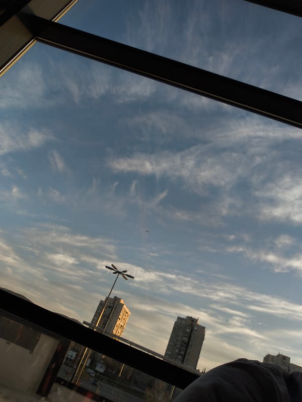 Window view captures cloudy afternoon scene in Stara Zagora