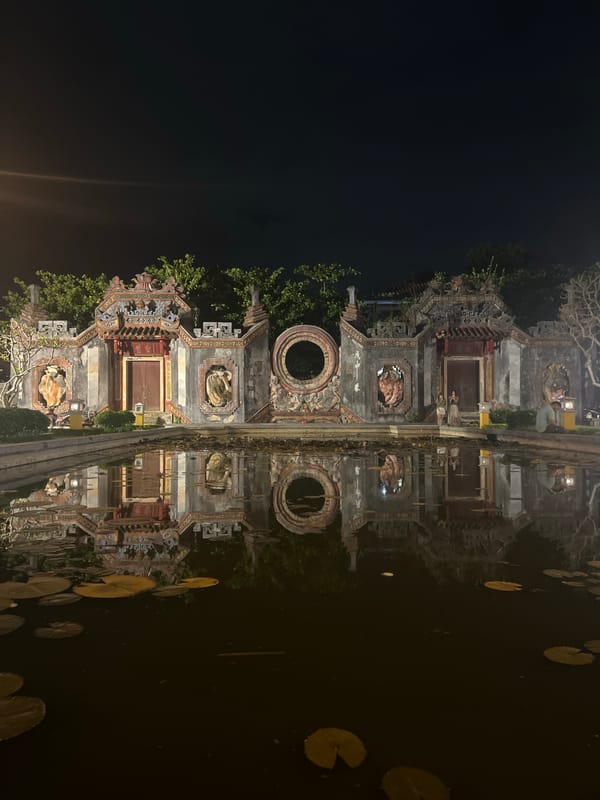 Hoi An at night: lanterns, street performance, and temple architecture