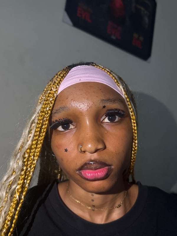 Bold beauty look with blonde braids and accessories in Ihiagwa
