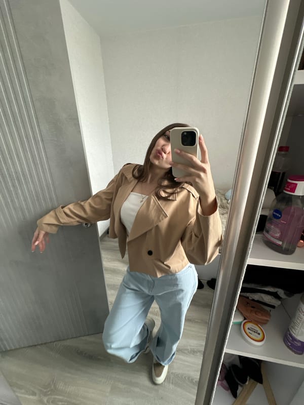 Woman takes mirror selfie in Yerevan early morning