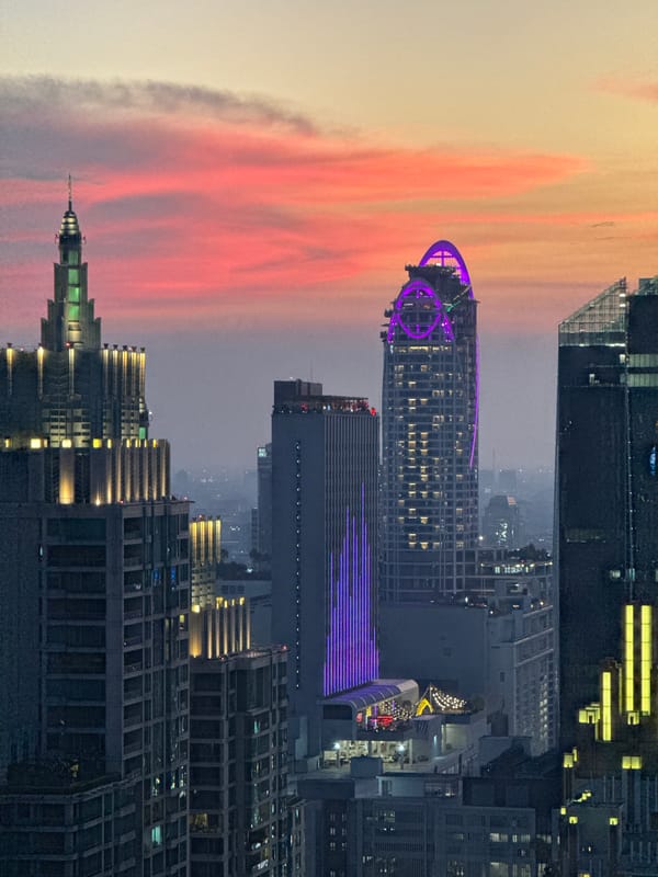 Bangkok rooftop pool captures sunset skyline views April 8