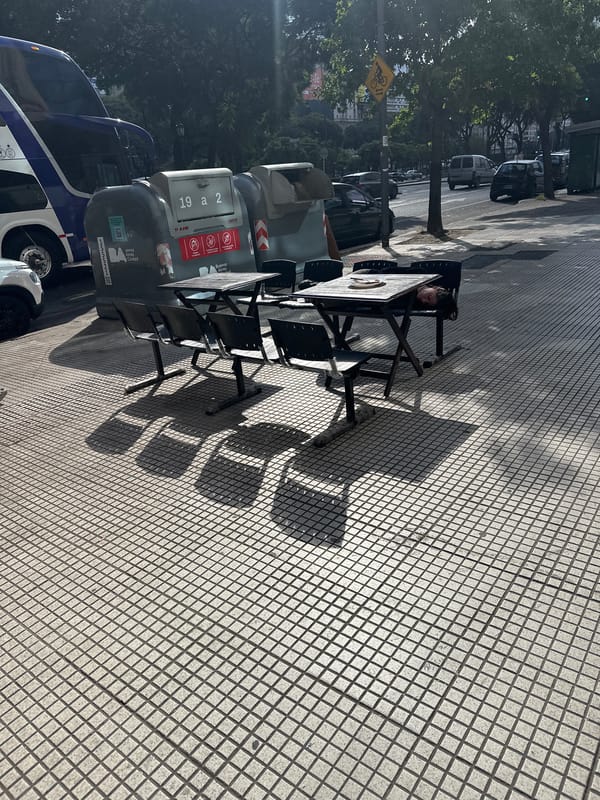 Outdoor cafe scene observed on Buenos Aires sidewalk