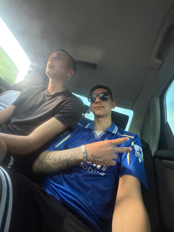 Three men spotted in vehicle, one flashing peace sign