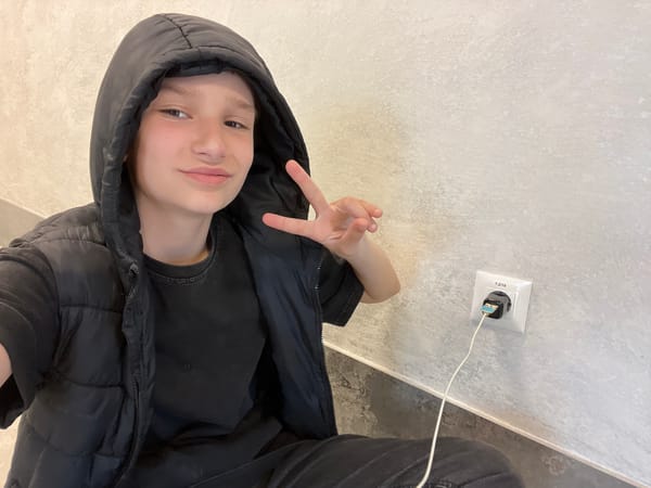 Traveler makes peace sign in Bulgarian hotel hallway