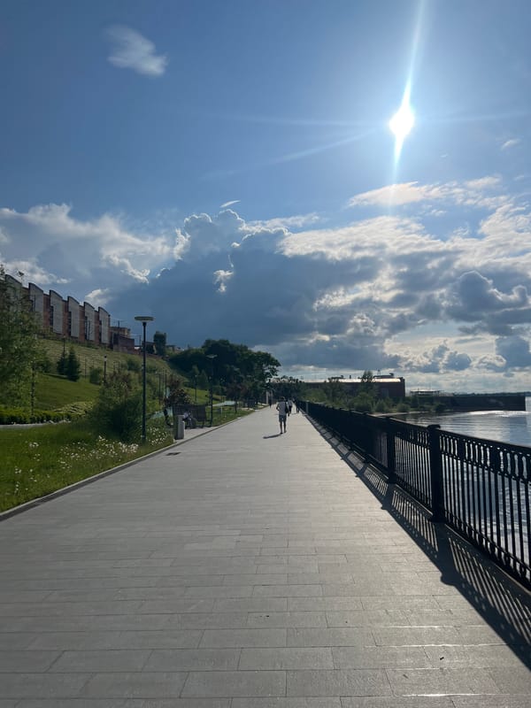 Witness documents Perm Embankment along Kama River under cloudy skies