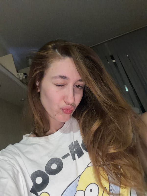 Woman takes selfies indoors in Sofia, Bulgaria