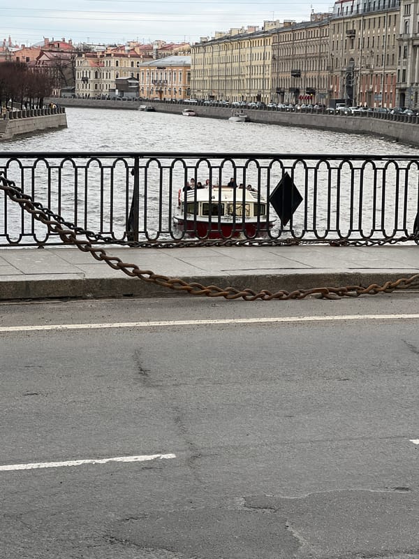 Saint Petersburg waterways see typical afternoon boat traffic, pedestrian activity