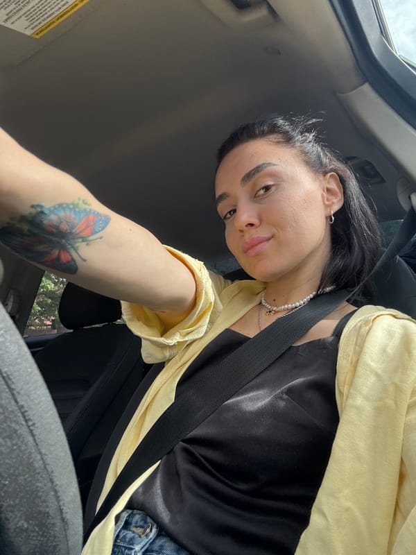 Woman takes car selfies in early morning Tbilisi