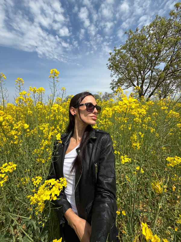 Woman photographed in yellow flower field near Lovech, Bulgaria