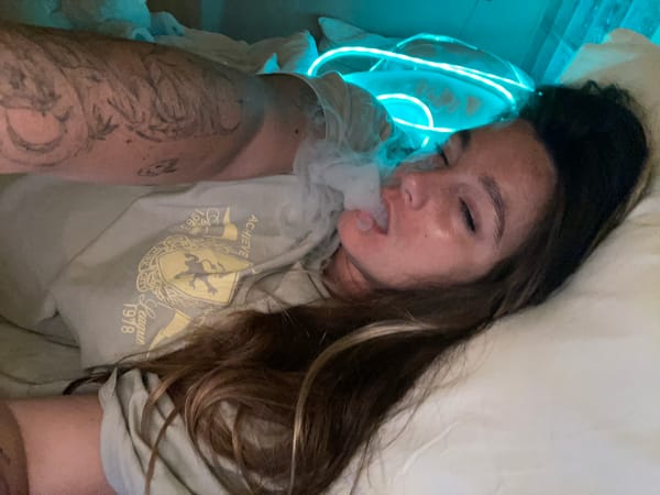 Vaping in neon-lit room, North Kuta, Bali